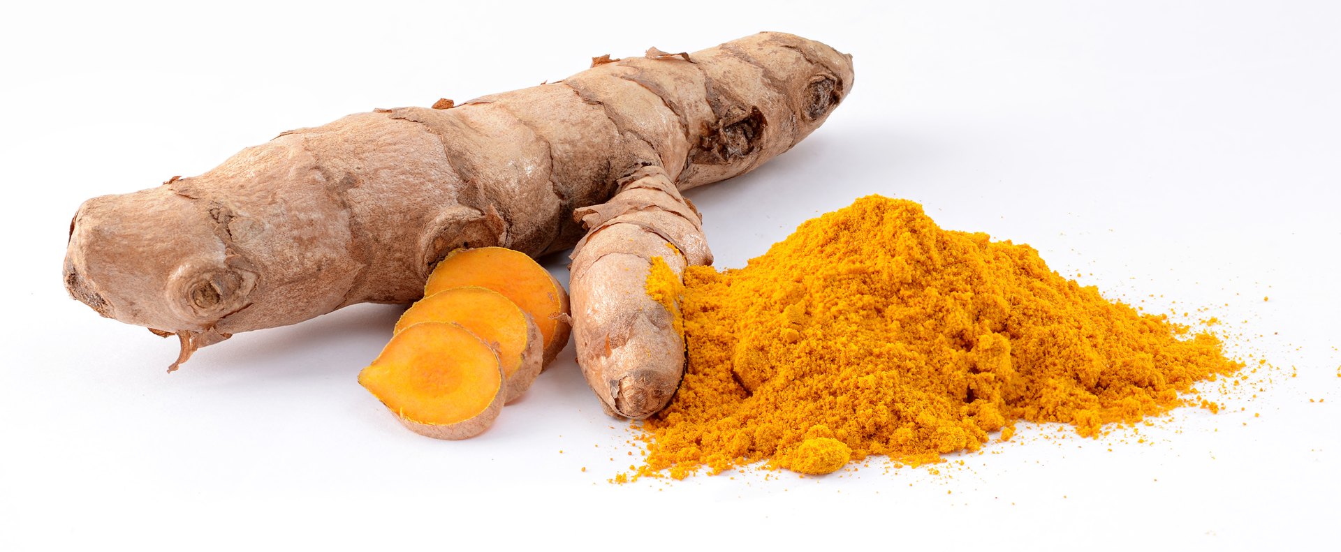 Fresh turmeric rhizomes, whole and cut to show their orange interior, beside ground turmeric.